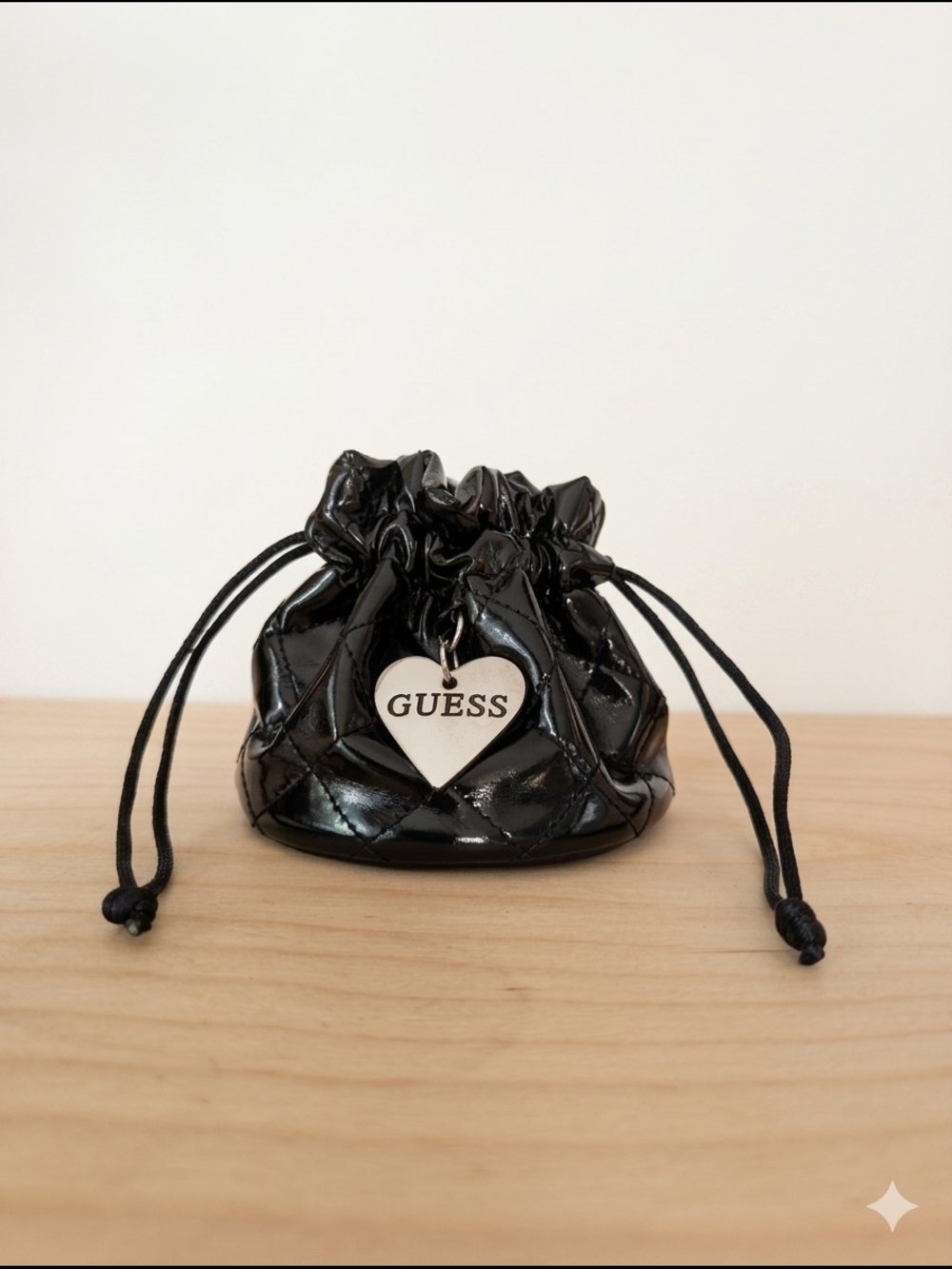 GUESS Black Quilted Patent Drawstring Pouch with Heart Charm